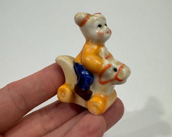 Vintage Ceramic little girl riding toy horse trinket figure. Ceramic Figurine trinket shelf