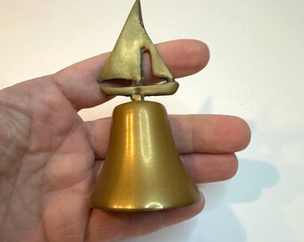 Vintage small brass nautical sailboat bell. dinner bell.