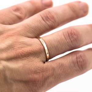 minimalist boho 14K yellow gold fill hammered ring band worn on finger
