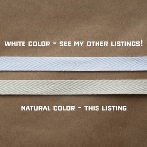 May include: Two samples of cotton twill tape, one white and one natural, on a brown paper background. The text "WHITE COLOR - SEE MY OTHER LISTINGS!" is above the white tape, and the text "NATURAL COLOR - THIS LISTING" is below the natural tape.