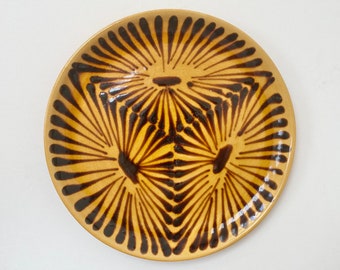 Vintage Swiss pottery decorative plate with tonal brown pattern and glaze, label Valcera Valais, mid century, retro