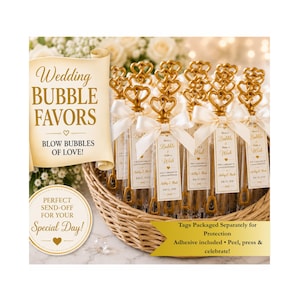 May include: Clear plastic bubble wands with gold heart-shaped handles and white satin bows, arranged in a woven basket. Each wand features a rectangular tag with the text Blow a Bubble & Make a Wish, For a Lifetime of Love & Happiness.