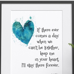 May include: A watercolour painting of a blue heart with a quote by A.A. Milne that reads: "If there ever comes a day when we can't be together, keep me in your heart, I'll stay there forever."