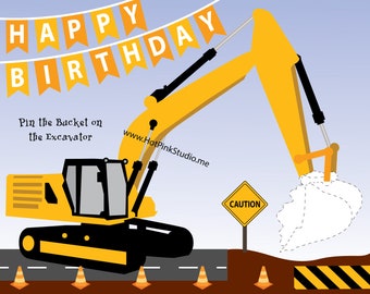 May include: A yellow excavator with a black cab and a white bucket with a dotted line outline. The excavator is on a brown dirt road with yellow and black striped barriers. A yellow caution sign is on a black pole. The text "Pin the Bucket on the Excavator" is on the left side of the image. The text "www.HotPinkStudio.me" is on the right side of the image. The text "HAPPY BIRTHDAY" is in yellow letters on a banner at the top of the image.