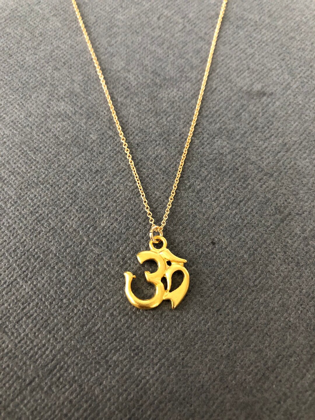 Gold chain shop with om pendant