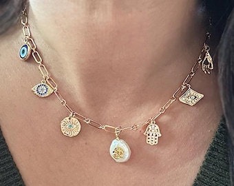 Collar con dije estilo bohemio: Ojo turco, mano de Hamsa, perla Om