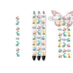 May include: Three white pens with black ink, featuring a repeating pattern of pastel colored bunnies and flowers. The pens have the words "Happy Easter" printed on them.