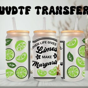 May include: Three frosted glass tumblers with bamboo lids and straws. The tumblers have a lime and leaf design. One tumbler has the text "When life gives you limes make margaritas".