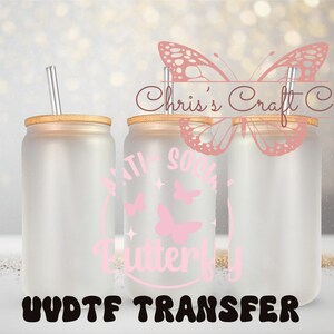 May include: Three clear frosted glass tumblers with bamboo lids and clear straws. The tumblers have a pink butterfly design with the text "Anti Social Butterfly" on one tumbler. The text "Chris's Craft Co." is visible on the background. The tumblers are on a sparkly gold surface. The text "UV DTF TRANSFER" is visible at the bottom of the image.
