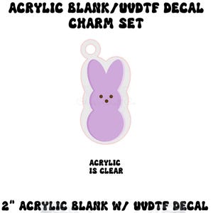May include: A clear acrylic charm set featuring a purple bunny design with brown dot eyes and a white outline. The charm is 2 inches in size and has the text "ACRYLIC BLANK/UUDTF DECAL CHARM SET" and "ACRYLIC IS CLEAR".