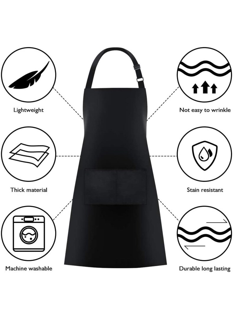 K&ouml;nnte beinhalten: Schwarze Sch&uuml;rze mit einer gro&szlig;en Tasche auf der Vorderseite. Die Sch&uuml;rze ist maschinenwaschbar, fleckenbest&auml;ndig, strapazierf&auml;hig und leicht. Sie ist auch knitterarm.