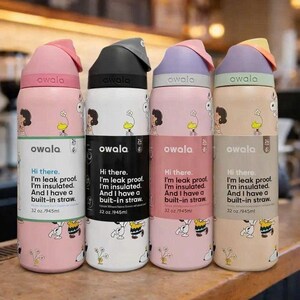 May include: Four Owala insulated water bottles, each with a different color lid and base. The bottles feature a cartoon design and text that reads "Hi there. I'm leak proof. I'm insulated. And I have a built-in straw. 32 oz./945ml."