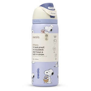 May include: A light purple Owala water bottle with a white and blue lid. The bottle features a Snoopy cartoon design and the text "Hi there. I'm leak proof. I'm insulated. And I have a built-in straw." It holds 32 oz / 945 ml.