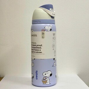 May include: A light purple Owala water bottle with a Snoopy pattern. The bottle has a white and blue lid with a push-button opening. Text on the bottle reads "I'm leak proof. I'm insulated. And I have a built-in straw."