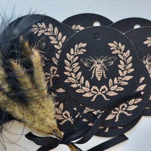 black kraft paper with bee and laurel gift tags