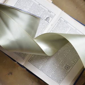 27 yard roll of light sage greige double face satin
