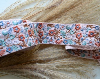 embroidered floral on dusty mauve trim