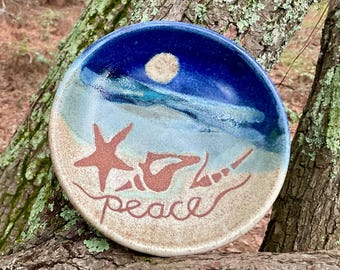 Sea shells have washed up onto the shore of this unique little peace bowl, ring dish, snack dish