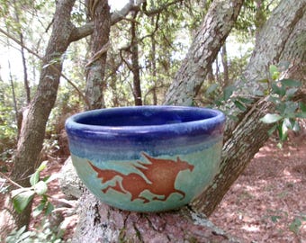 The wild horses of Corolla gallop around the outside of this sweet little bowl