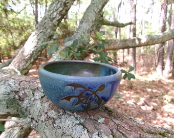 Peace turtles swim through the oceanic glazes of this sweet little bowl