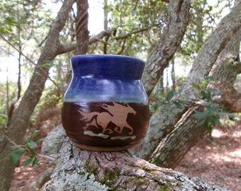 The wild horses of Corolla gallop around the outside of this stout coffee mug