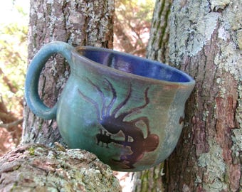 Kokopelli on guitar leads 3 peace turtles across this unique soup mug..think peaceful thoughts with a mug of soup or cereal