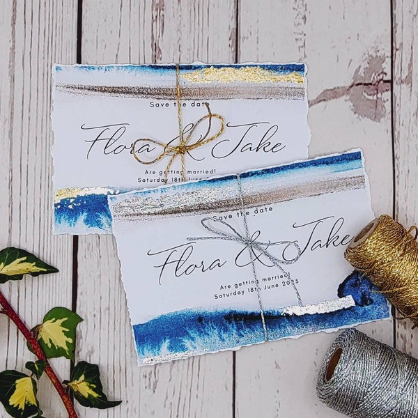 Watercolour sea beach inspired Save the Dates with silver or gold leaf and soft hand torn edges, nautical, destination