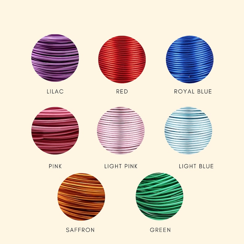 May include: A collection of colorful wire spools in a variety of colors, including lilac, red, royal blue, pink, light pink, light blue, saffron, and green. Each spool is labeled with its color name.