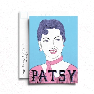 May include: A vintage-style postcard featuring a cartoon illustration of a woman with short, dark blue hair. She is wearing a pink shirt with a white collar and a pink bow tie. The text "PATSY" is written in black letters across the bottom of the postcard. The background is a light blue color.