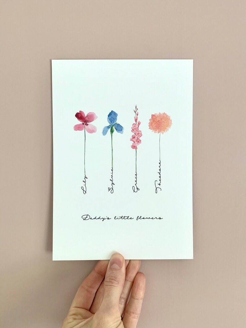 May include: A white card with a watercolor illustration of four flowers, each with a different color and name written underneath. The flowers are pink, blue, pink, and orange. The text at the bottom reads "Daddy's little flowers."