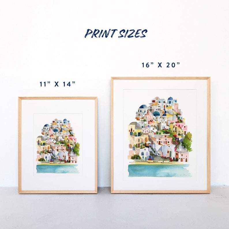 Peut inclure: Deux impressions encadr&eacute;es d'une peinture &agrave; l'aquarelle repr&eacute;sentant une ville color&eacute;e avec des b&acirc;timents blancs, des d&ocirc;mes bleus et des arbres verts. Les tailles d'impression sont de 11" x 14" et 16" x 20".