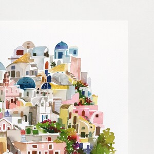Peut inclure: Peinture &agrave; l'aquarelle d'un village blanc avec des accents bleus, sur fond blanc. Le village est construit &agrave; flanc de colline et pr&eacute;sente de nombreux b&acirc;timents aux toits arrondis et aux petites fen&ecirc;tres. On y trouve &eacute;galement quelques arbres et fleurs.