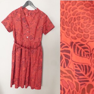 60s charming dress. XL size. Belted cotton red high waisted dress with off black retro floral patterns. Excellent vintage condition.