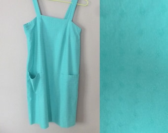 80s summer dress. S size. Lovely retro A line two pockets short dress, made from thick turquoise fabric. In a very good vintage condition.