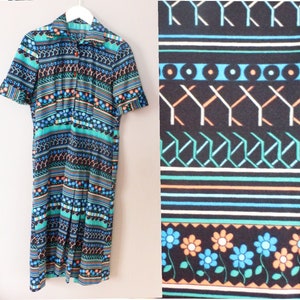 70s shirt dress. L size. Polyester multicolour summer hippie dress, geometrical and floral retro designs. In a very good vintage condition.