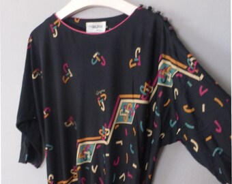 70s VIRGINIE drop waist dress. M size. Black belted dress with multicolor retro patterns, 3/4 sleeves. In a very good vintage condition.