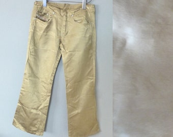 90s Diesel pants. W26 L 32 size. Cotton /viscose metallic gold denim low rise teen / XXS adult trousers. In a very good vintage condition.