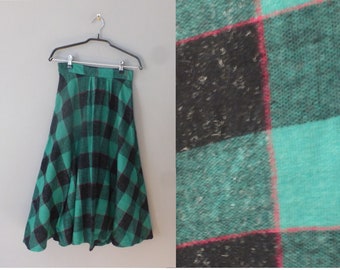 1970s plaid skirt. XS size. Wool / synthetic green, blue hippie high waist long skirt with red lines. In a very good vintage condition.