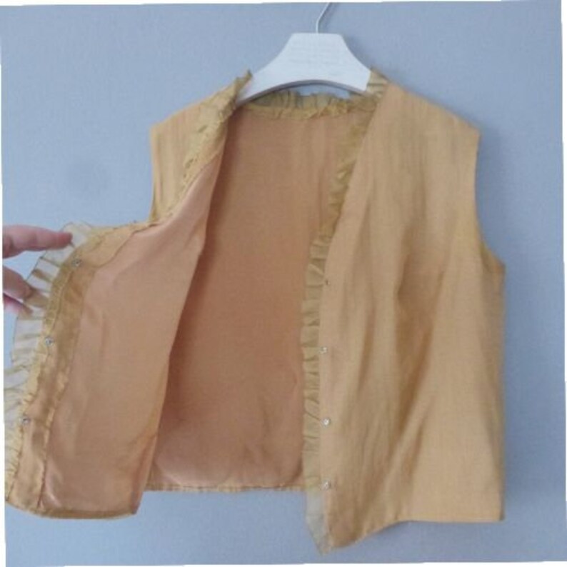 Mustard yellow sleeveless polyester top with ruffled detail In a very good vintage condition. XL size 60s chic blouse straight fit