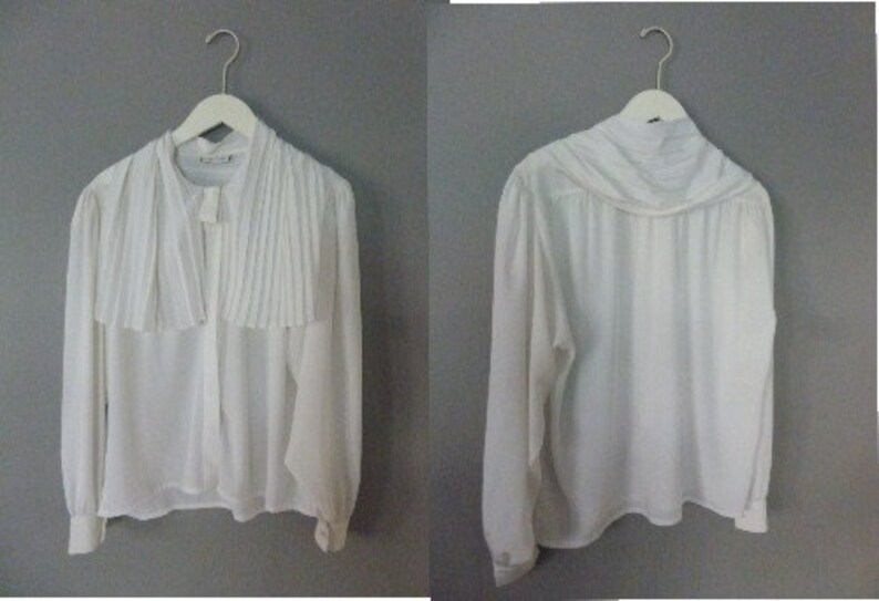 In a very good vintage condition. White oversized pleated shirt with big pleated collar XXL size 100/% polyester 80s Weinberg shirt