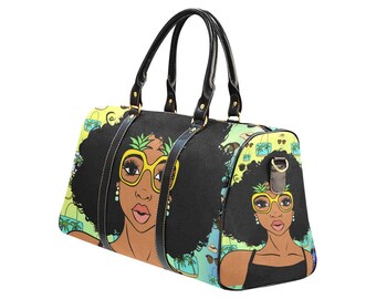May include: Black duffel bag featuring a vibrant illustration of a woman with large sunglasses and a pineapple in her hair. The bag has black handles and trim, with a colorful tropical background.