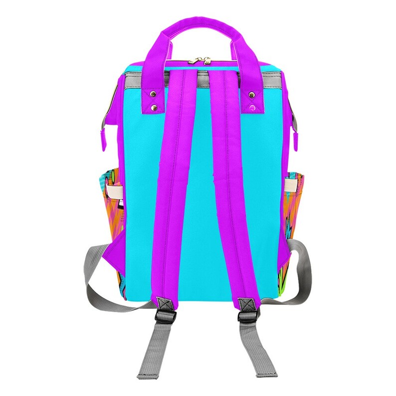 May include: A colorful backpack with a vibrant design. The backpack features a bright turquoise main body, complemented by purple straps and a handle. Gray accents and a zipper closure add detail. Side pockets showcase a multicolored graphic.