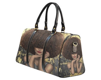 May include: A duffel bag featuring a woman with a large afro. The bag has black leather handles and trim, with gold-colored hardware. The background has a gold and black textured design. The woman's image is repeated on both sides of the bag.