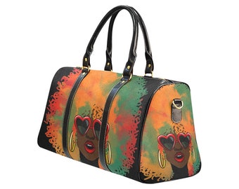 May include: A black duffel bag featuring a vibrant illustration of a woman with heart-shaped sunglasses and gold hoop earrings. The bag has black handles and accents, with a colorful background of orange, green, and red.