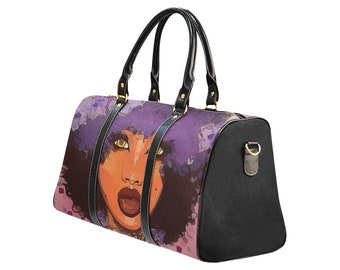 May include: A duffel bag featuring a vibrant illustration of a woman's face with purple hair and gold eyes. The bag has black leather handles and accents, with a black end panel. The bag is designed for travel.