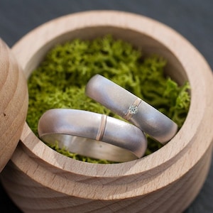 His and hers matching wedding rings:  - Silver and gold wedding band set -  - Engraved rings