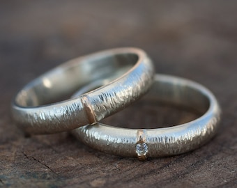 White gold wedding bands. Ring set in gold.