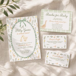 May include: A baby shower invitation set featuring a large card with a green oval frame, a bow, and goose illustrations, plus two smaller diaper raffle cards and a books for baby card, all decorated with yellow flowers and green foliage motifs.