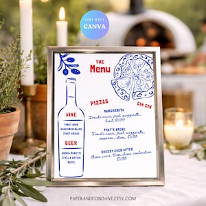 May include: A framed menu with a blue and white design. The menu lists wine and beer options, along with pizza choices like Margherita and That's Amore. The text "Edit with Canva" is visible.