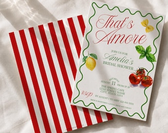 May include: A bridal shower invitation card featuring the text That's Amore, Amelia's Bridal Shower, and event details, decorated with a lemon, basil, and tomatoes, framed by a green wavy border, paired with a red and white striped envelope liner.